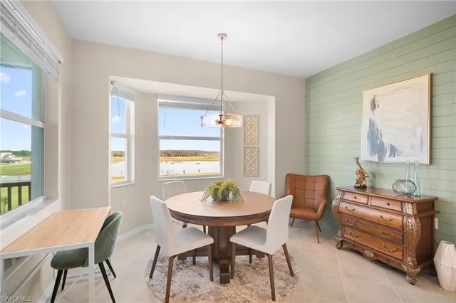 a view of a dining room with furniture window and outside view