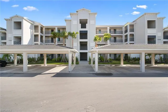 front view of a building with a garden