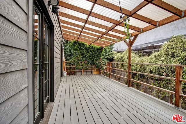a view of a balcony with wooden floor