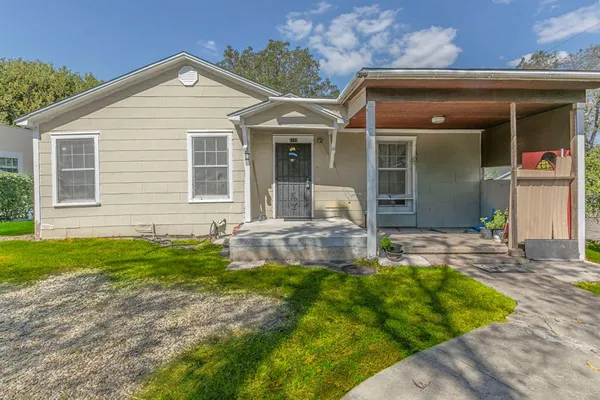 front view of a house with a yard