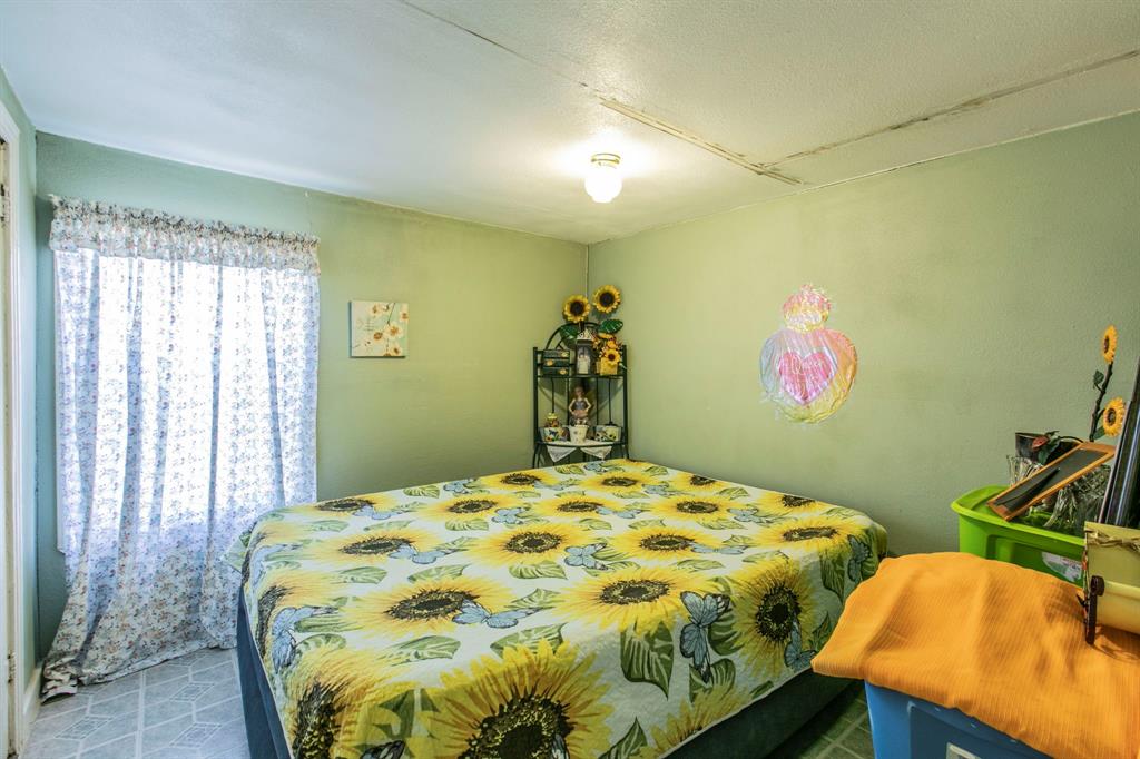 2101 Pine Avenue Waco, TX 76708 - Photo 18 of 27 a bedroom with a bed and dresser