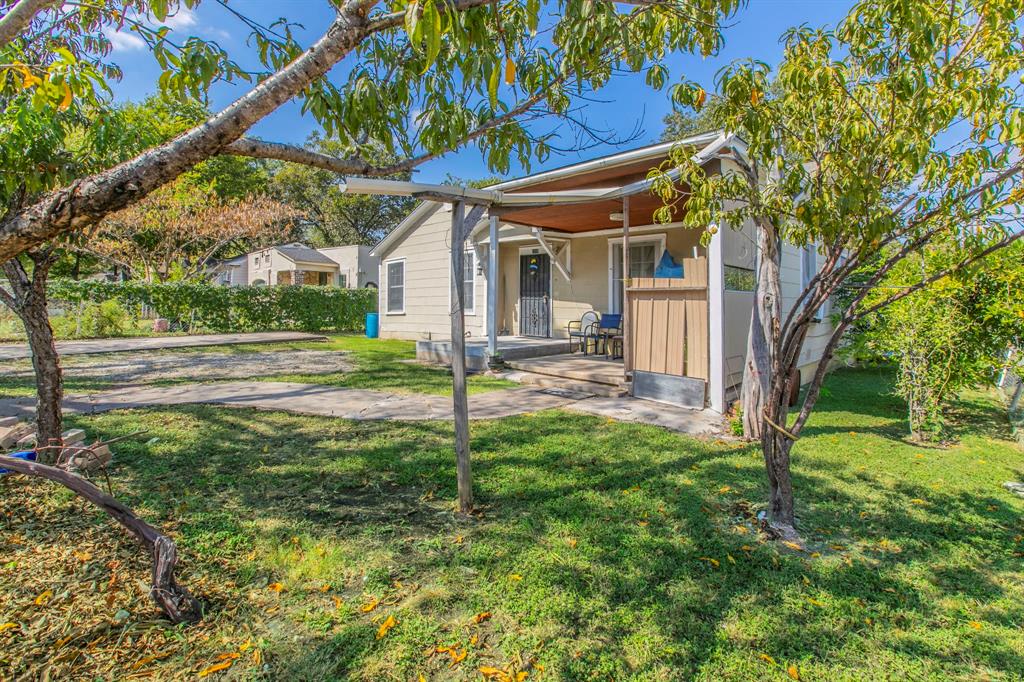 2101 Pine Avenue Waco, TX 76708 - Photo 22 of 27 a view of a house with backyard and a tree