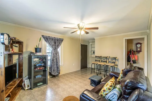 a view of a livingroom with furniture and a flat screen tv