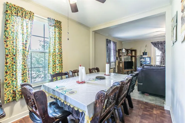 a view of a dining room with furniture and window