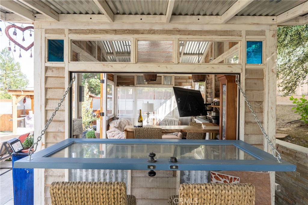 4010 Traffic Way Atascadero, CA 93422 - Photo 41 of 56 Clever she shed design with a drop-down door that becomes an outdoor bar