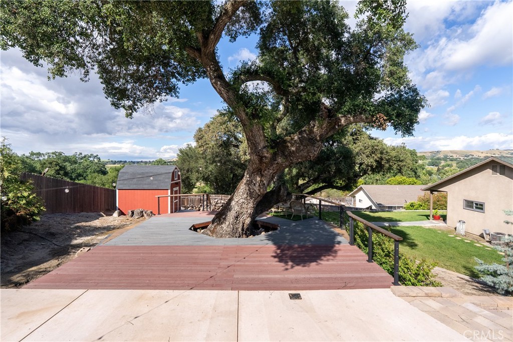 4010 Traffic Way Atascadero, CA 93422 - Photo 9 of 56 Expansive Trex deck wraps around a beautiful oak tree