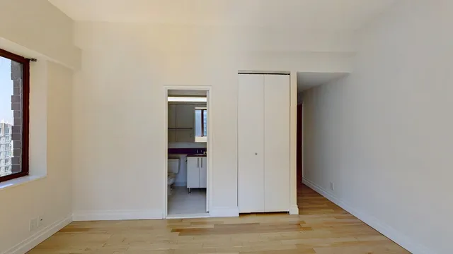 a view of an empty room with a window
