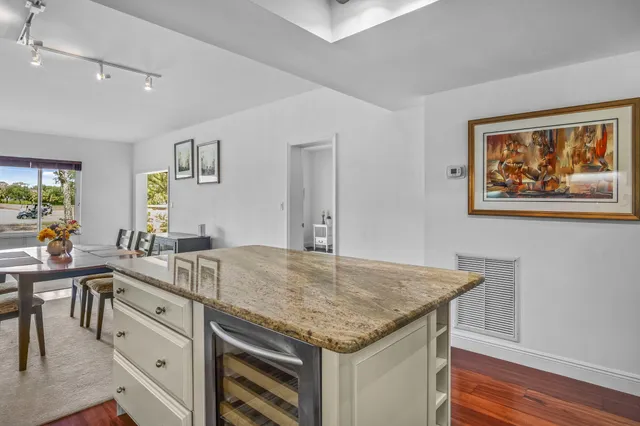 a view of center island cabinets and wooden floor