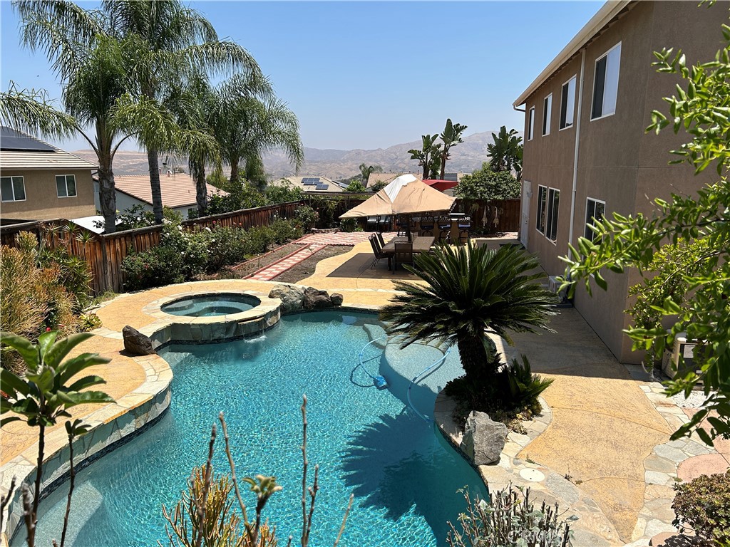 8634 Hunt Canyon Road Corona, CA 92883 - Photo 25 of 31 a view of a swimming pool with a patio