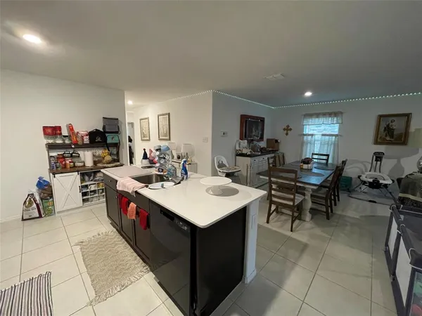 a kitchen with a sink a counter top space and appliances