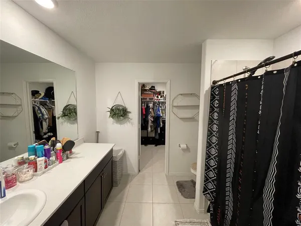 a bathroom with a double vanity sink and mirror
