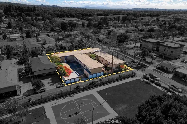 an aerial view of a yard with horses