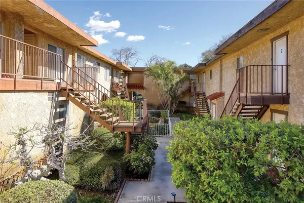 a view of a house with a yard and plants