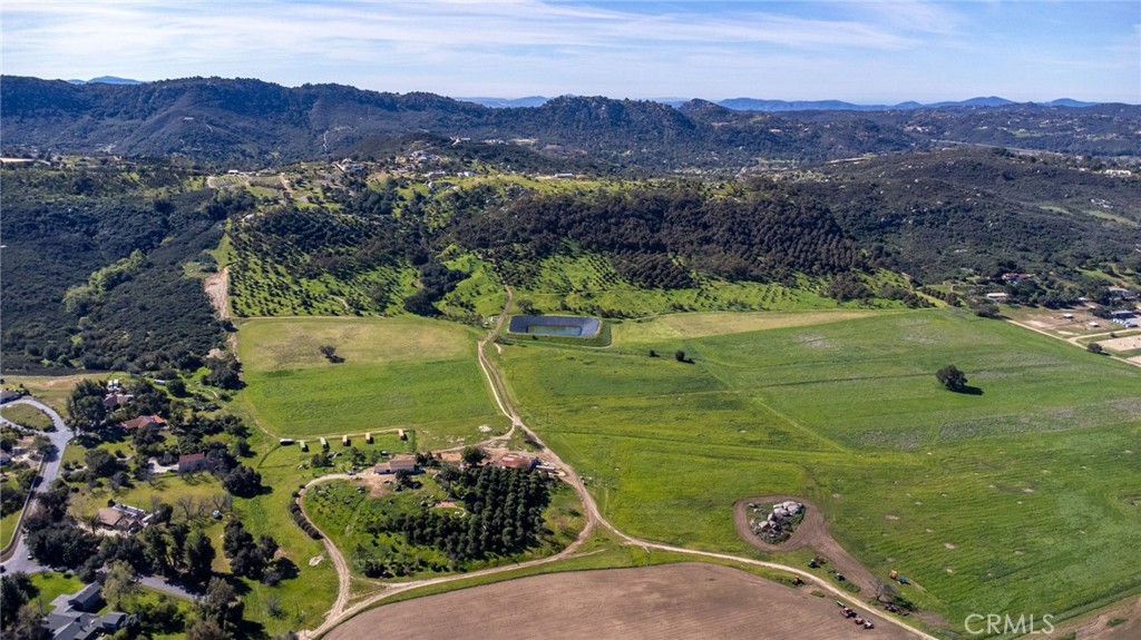 15300 Round Tree Road Valley Center, CA 92082 - Photo 9 of 12 an aerial view of a golf course with parking space