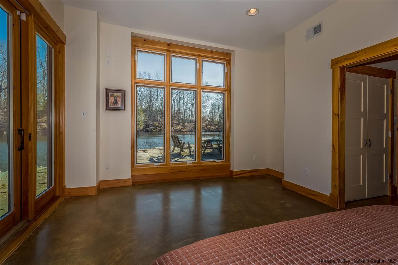 11 Sparkling Ridge Road New Paltz, NY 12561 - Photo 13 of 34 a view of a livingroom with wooden floor and a window