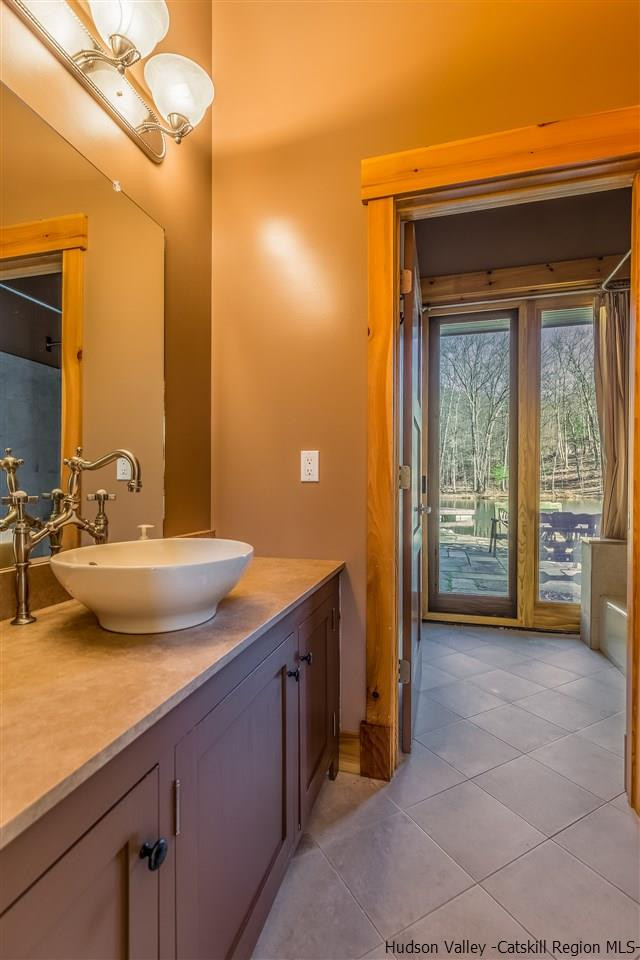 11 Sparkling Ridge Road New Paltz, NY 12561 - Photo 15 of 34 a bathroom with a sink and a mirror