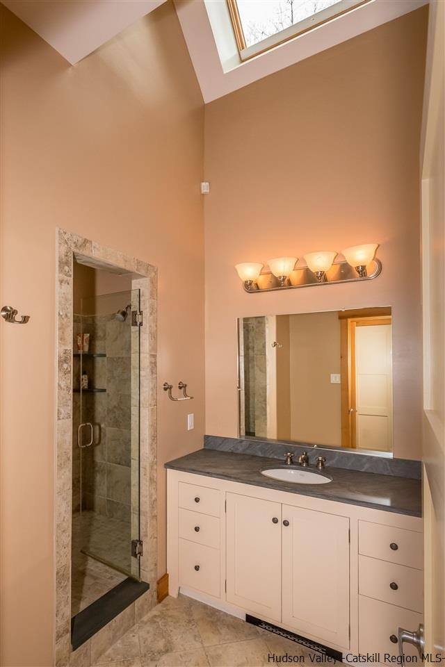 11 Sparkling Ridge Road New Paltz, NY 12561 - Photo 17 of 34 a bathroom with a granite countertop sink and a mirror
