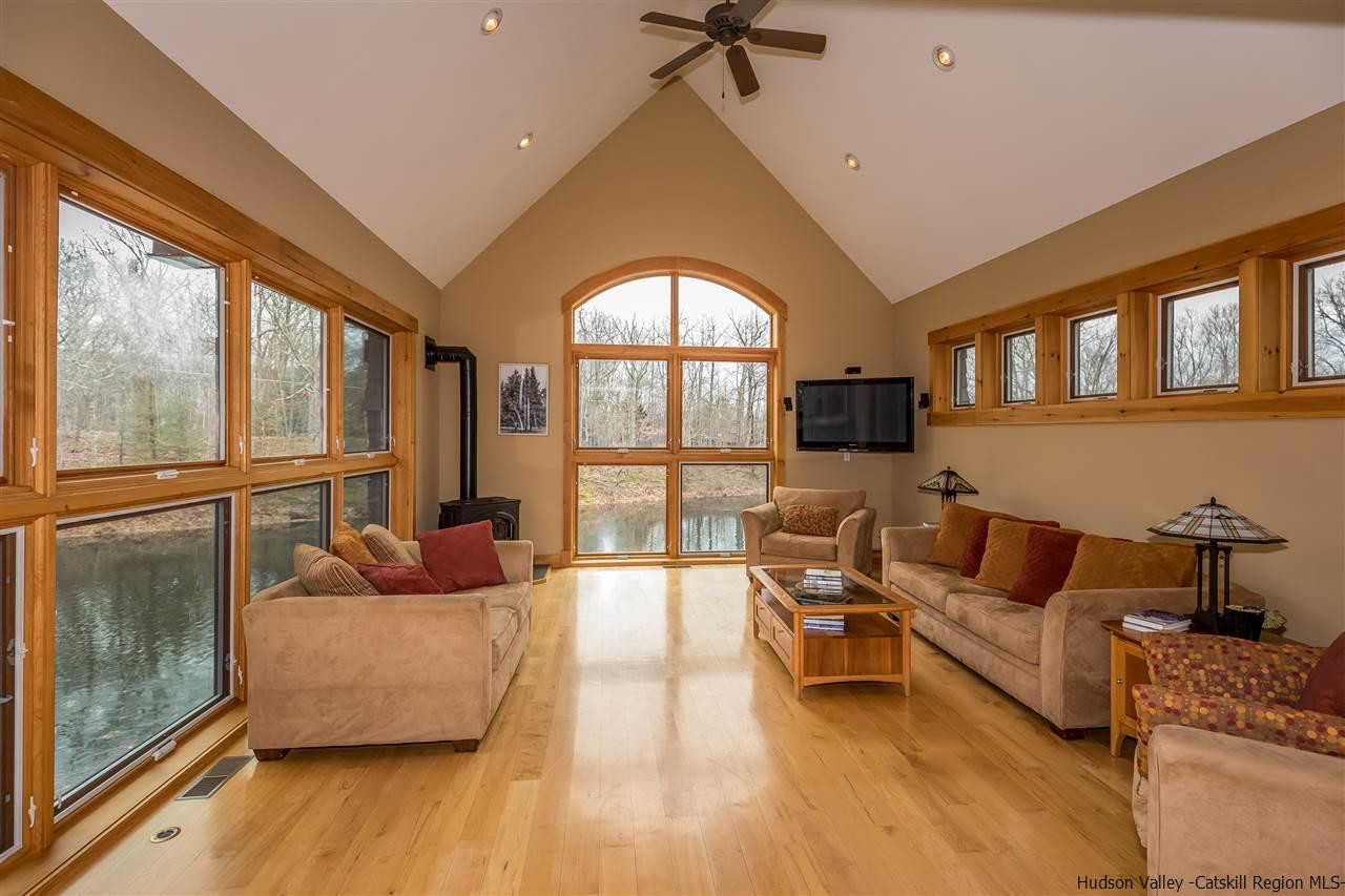 11 Sparkling Ridge Road New Paltz, NY 12561 - Photo 22 of 34 a living room with furniture and a large window