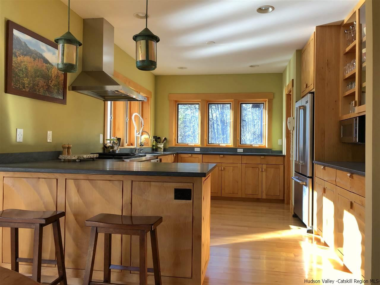 11 Sparkling Ridge Road New Paltz, NY 12561 - Photo 23 of 34 a kitchen with stainless steel appliances granite countertop a sink and a refrigerator