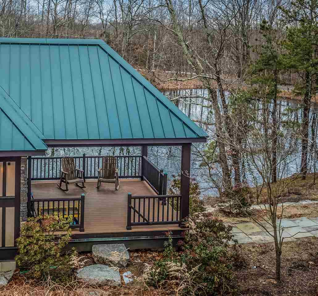 11 Sparkling Ridge Road New Paltz, NY 12561 - Photo 28 of 34 a view of a small house with yard and deck
