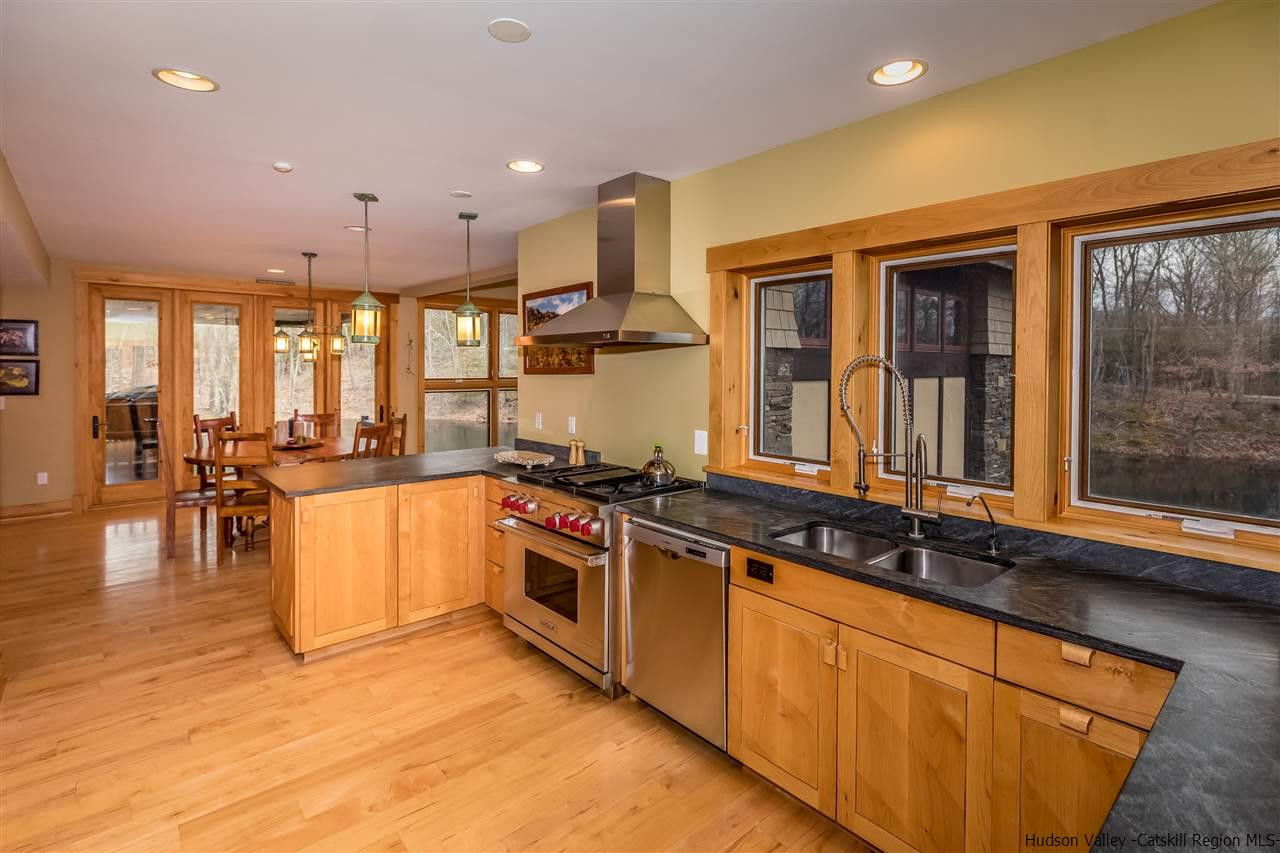 11 Sparkling Ridge Road New Paltz, NY 12561 - Photo 7 of 34 a large kitchen with stainless steel appliances granite countertop a stove and a sink