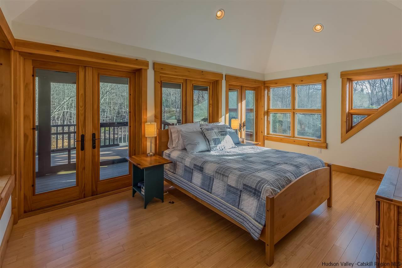 11 Sparkling Ridge Road New Paltz, NY 12561 - Photo 9 of 34 a bedroom with a bed and wooden floor