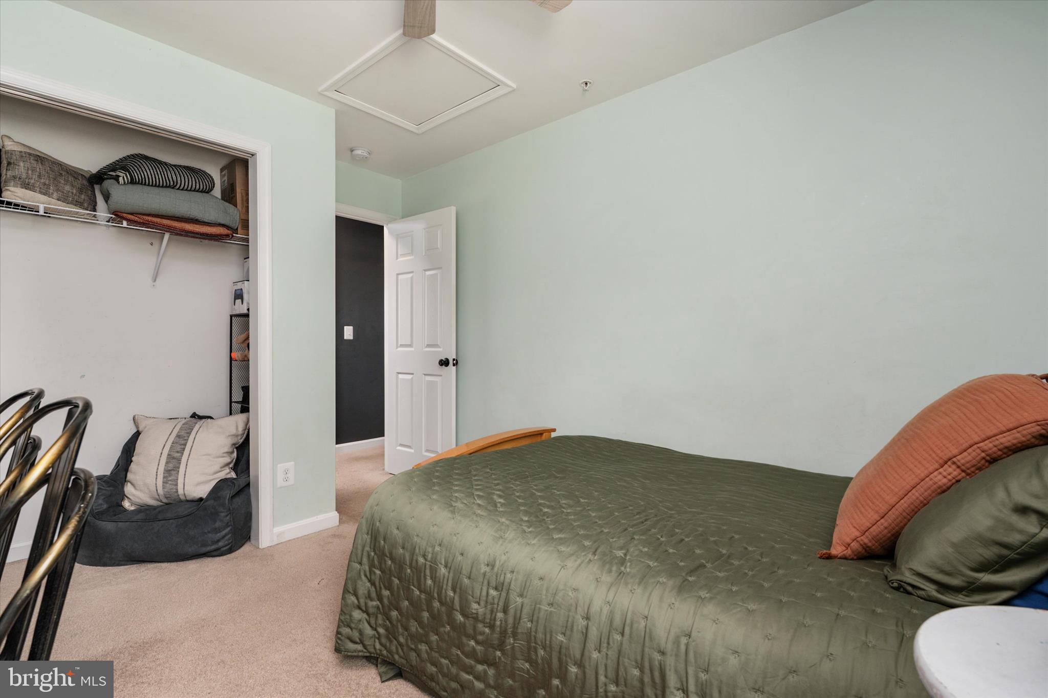 200 Newtown Road Chester, MD 21619 - Photo 27 of 50 a bedroom with a bed and a chair