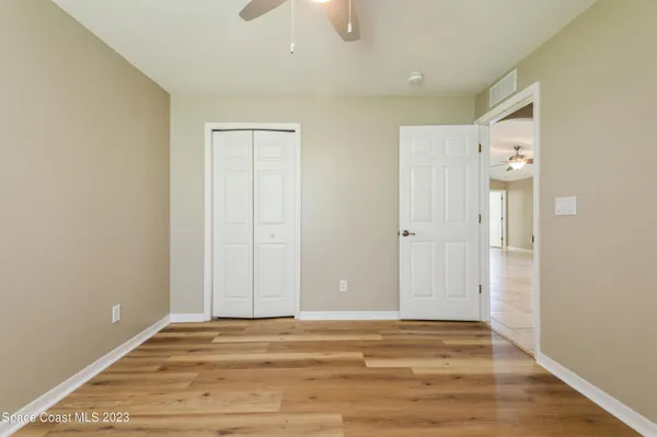 a view of a livingroom with wooden floor