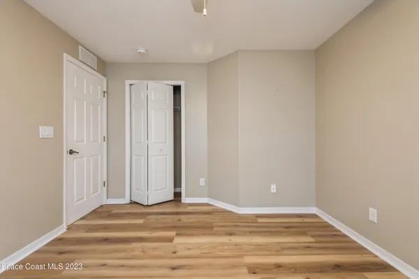 a view of a livingroom with wooden floor