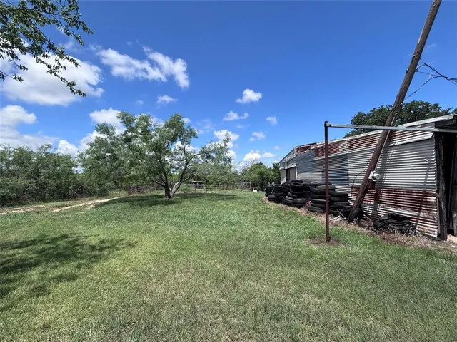 a front view of house with yard and seating area