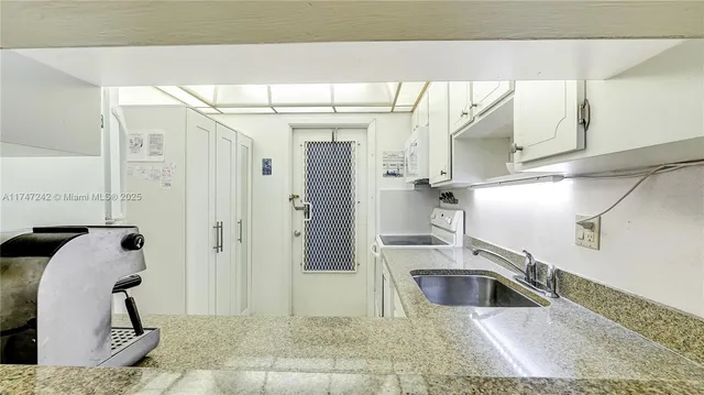 a bathroom with a sink and shower