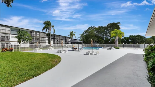 a view of a swimming pool with a patio