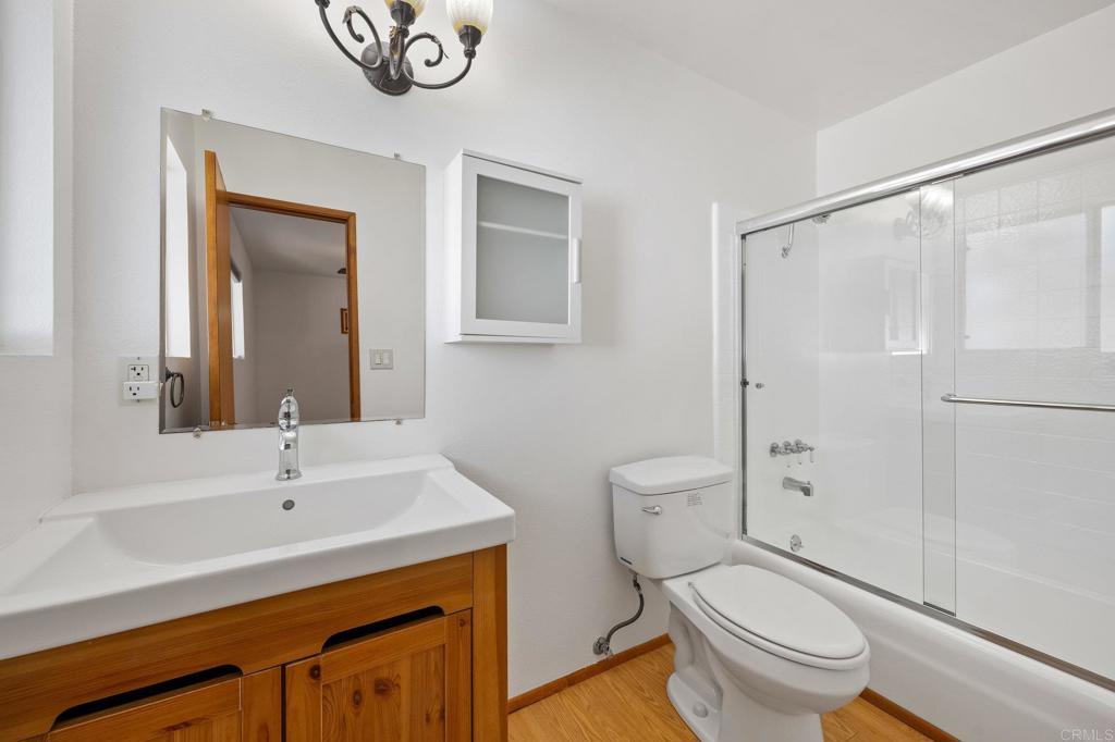 1054 Hermes Avenue Encinitas, CA 92024 - Photo 20 of 37 a bathroom with a sink a toilet and shower