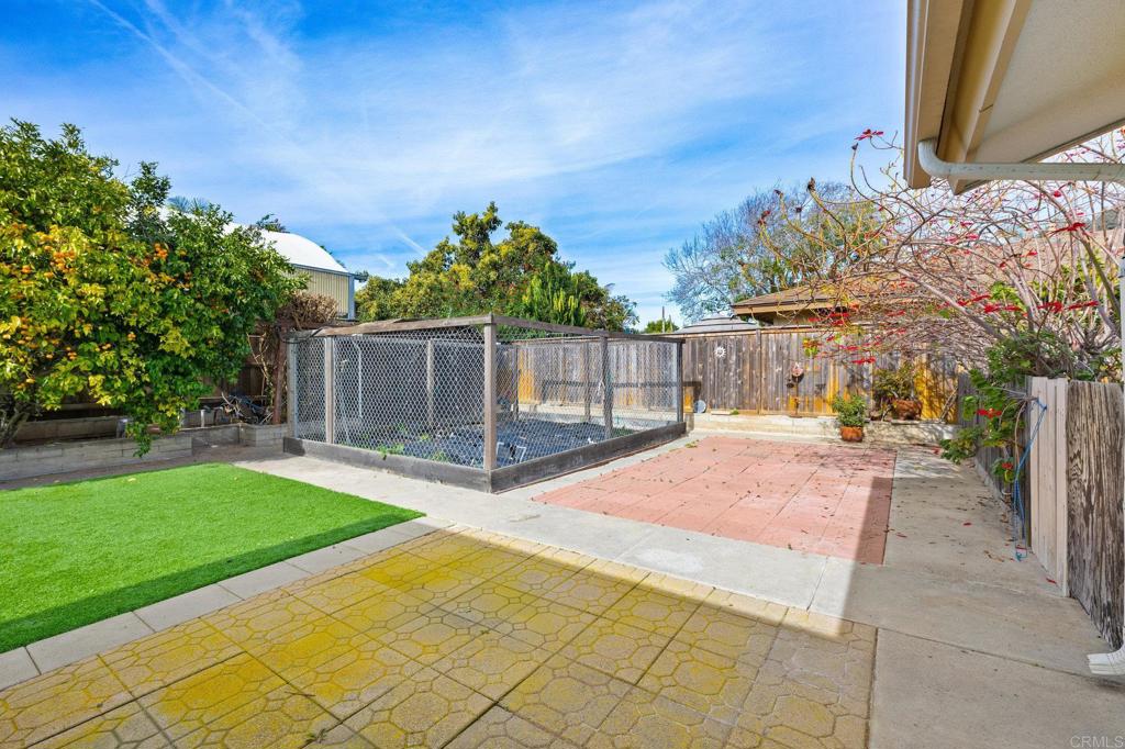 1054 Hermes Avenue Encinitas, CA 92024 - Photo 24 of 37 a front view of a house with a yard and garage