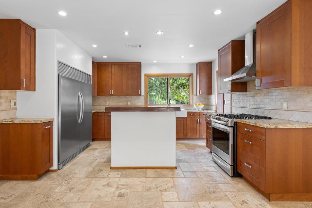 1054 Hermes Avenue Encinitas, CA 92024 - Photo 9 of 37 a kitchen with stainless steel appliances granite countertop a stove a sink dishwasher and a refrigerator