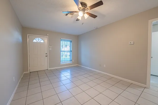 a view of an empty room and window