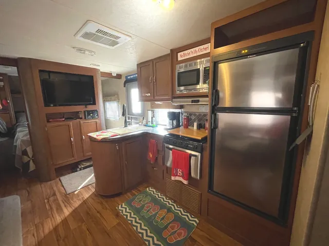 a view of a dining room with furniture and window
