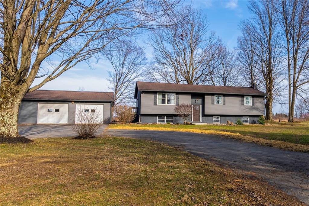 25 Maple Road Greenville, PA 16125 - Photo 1 of 14 a view of a house with a yard and large trees