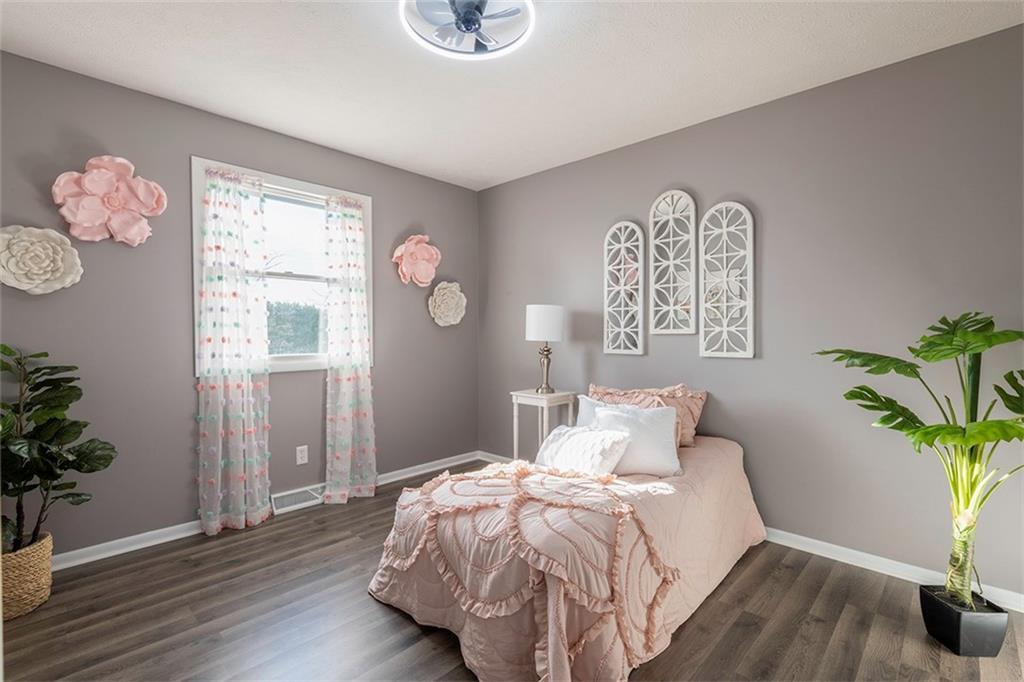 25 Maple Road Greenville, PA 16125 - Photo 11 of 14 a bedroom with a bed and a potted plant
