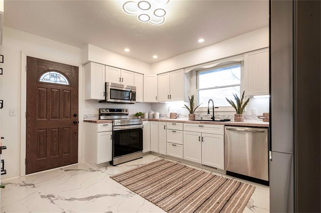 25 Maple Road Greenville, PA 16125 - Photo 2 of 14 a kitchen with a sink appliances and cabinets