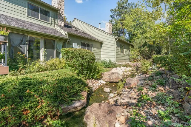 a view of a house with a tree