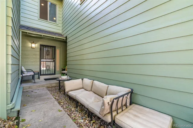 a view of a chairs in back of the house
