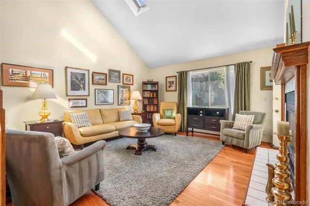 a living room with furniture or couch and a wooden floor