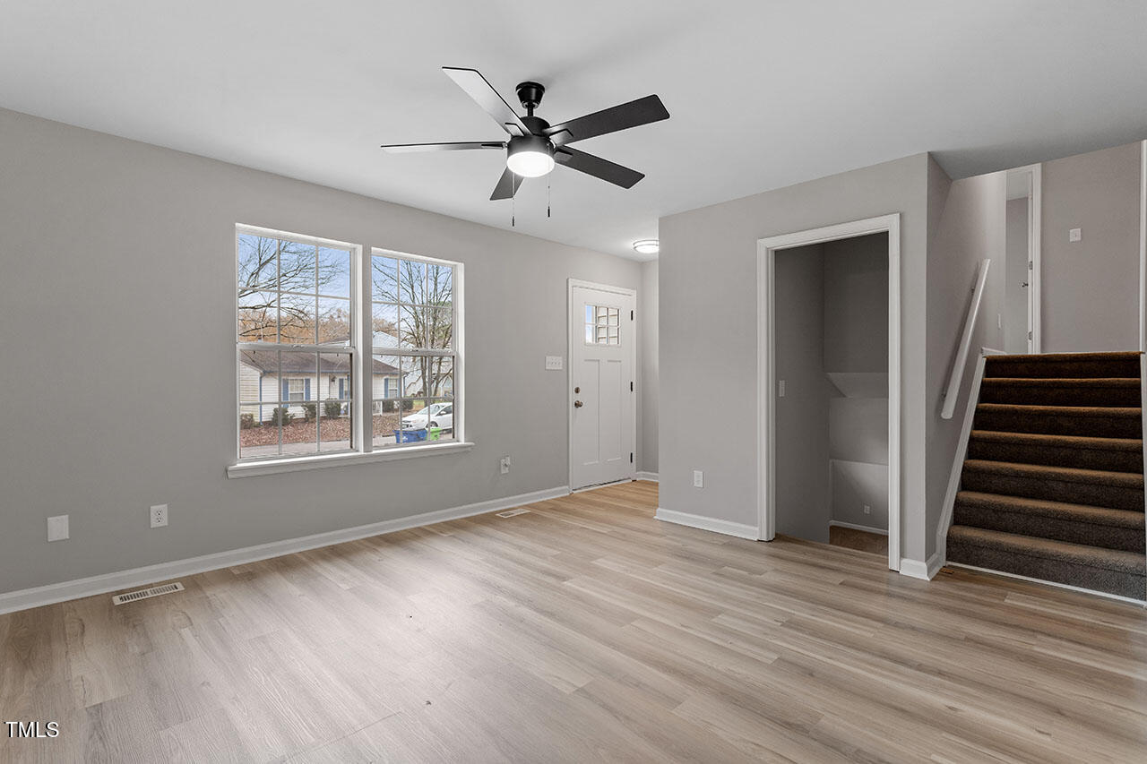 8341 Wynewood Court Raleigh, NC 27616 - Photo 18 of 35 wooden floor in an empty room with a window