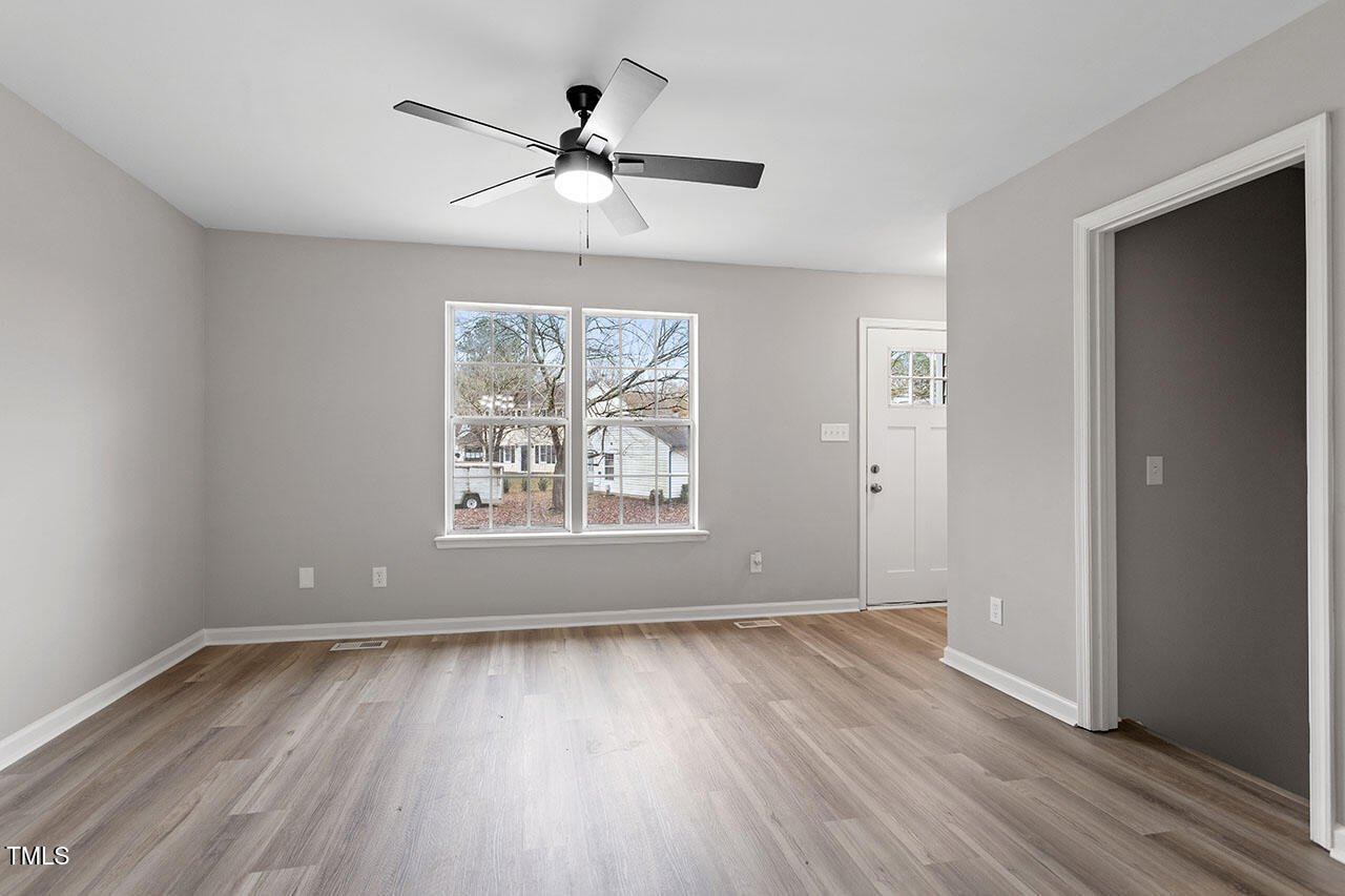 8341 Wynewood Court Raleigh, NC 27616 - Photo 19 of 35 wooden floor in an empty room with a window