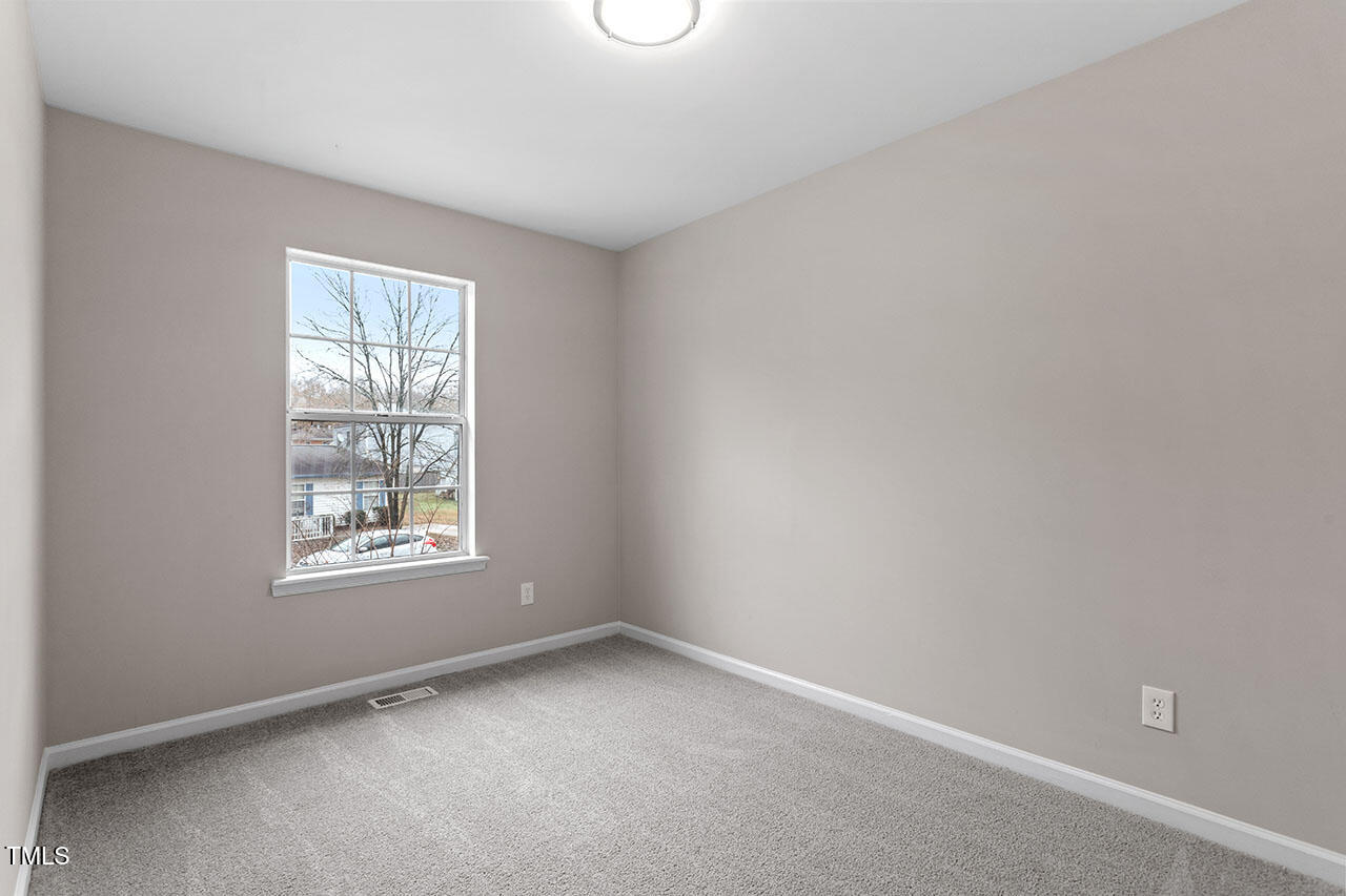 8341 Wynewood Court Raleigh, NC 27616 - Photo 21 of 35 an empty room with a window