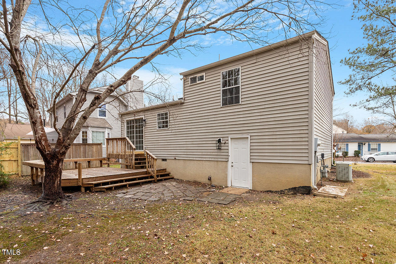 8341 Wynewood Court Raleigh, NC 27616 - Photo 29 of 35 a small white house with a white roof and tree