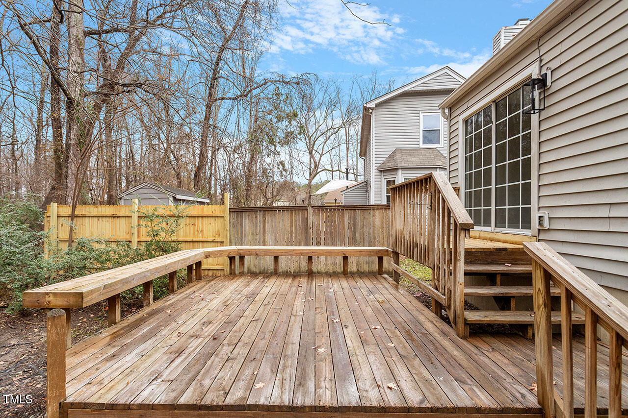 8341 Wynewood Court Raleigh, NC 27616 - Photo 30 of 35 a view of a balcony with wooden floor and fence