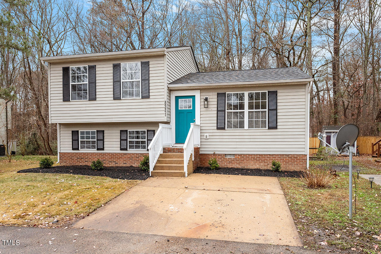 8341 Wynewood Court Raleigh, NC 27616 - Photo 32 of 35 a front view of a house with garden