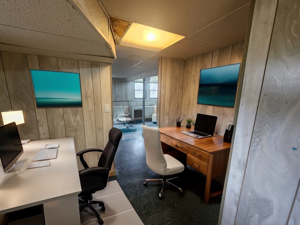 21 Spaulding Road Chelmsford, MA 01824 - Photo 31 of 40 a view of a workspace with furniture and a kitchen